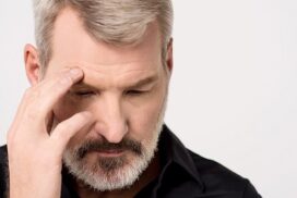 Frustrated man holding his head